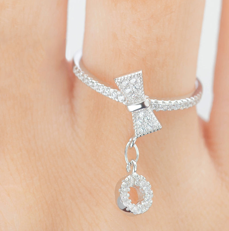 Bow & Dangling Circle Ring With Cubic Zirconia